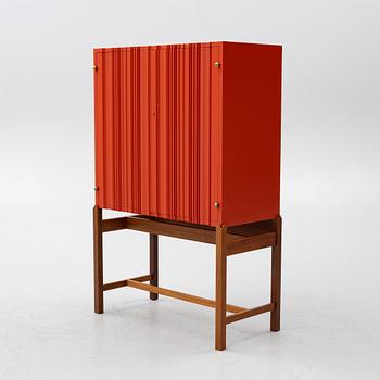 Josef Frank, a red lacquered cabinet, model 2192, 'The Cardboard Cabinet' by Svenskt Tenn, after 1985.
