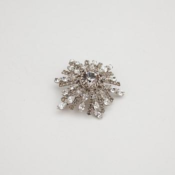 CHRISTIAN DIOR reportedly, a flower shaped brooche with decorative stones.