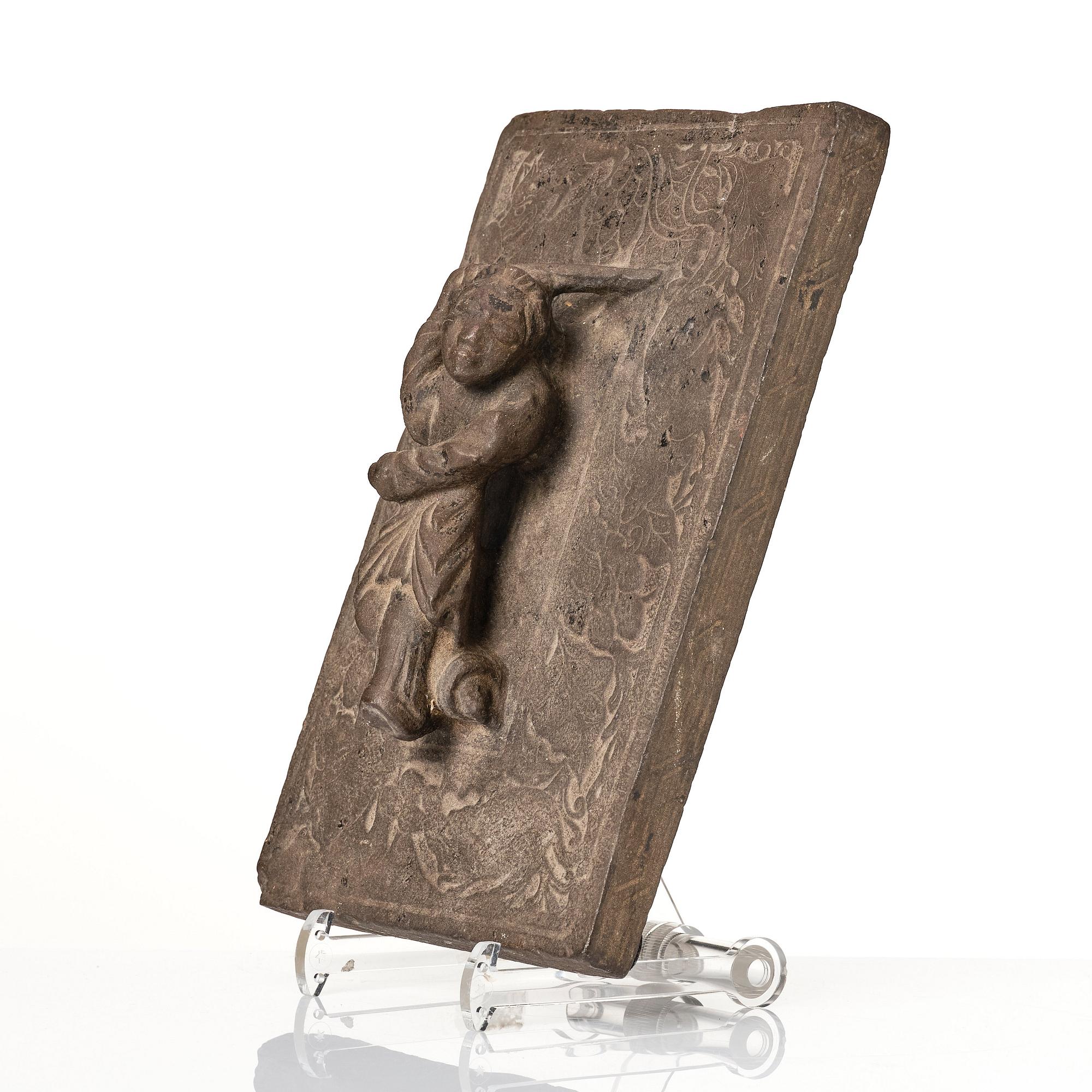 A heavy stone slate/press, presumably Ming dynasty (1368-1644).