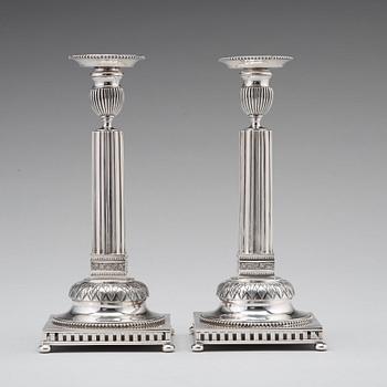 A pair of Swedish 18th century silver candlesticks, Stephan Westerstråhle, Stockholm 1793, one nozzle J E Torsk 1895.