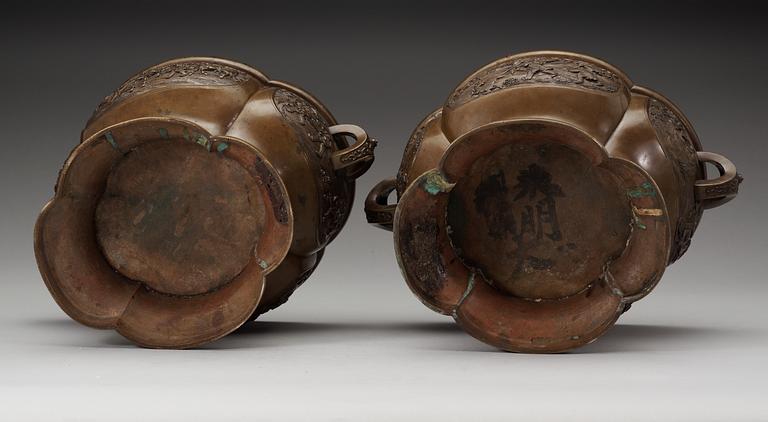 A pair of lobed bronze flower pots, Qing dynasty, with Xuandes six character mark to the interior.