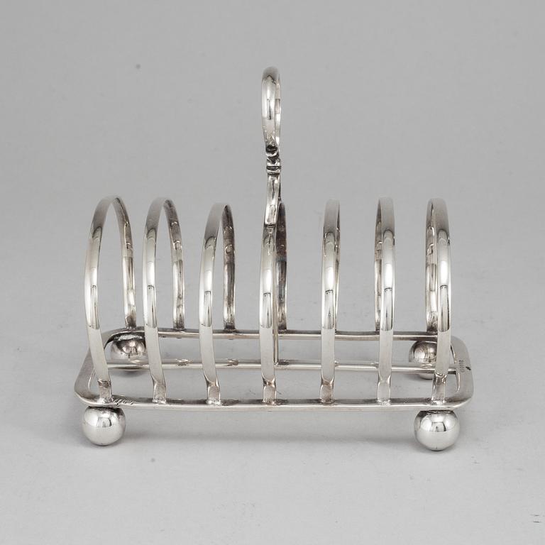 An English 20th century silver-plated toast rack, marked WH.