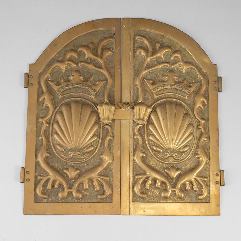 A pair of art nouveau brass oven hatches, early 20th century.