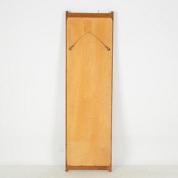 A 1960's teak mirror.