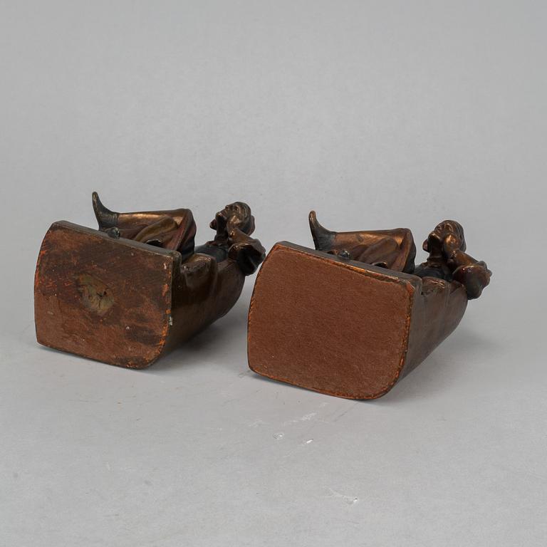 Two brass book ends, 20th century.