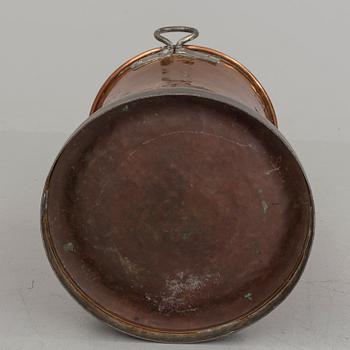 A 19th century copper barrel.