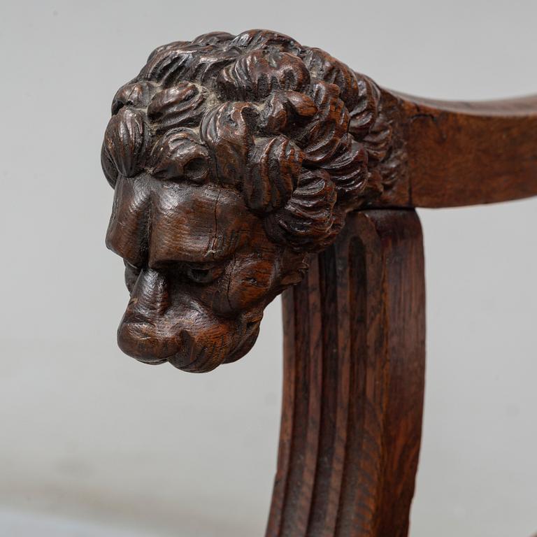 A Baroque style oak armchair, first half of the 20th Century.