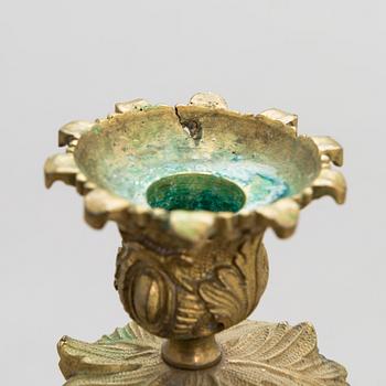A pair of bronze candelabra from the latter half of the 19th Century.