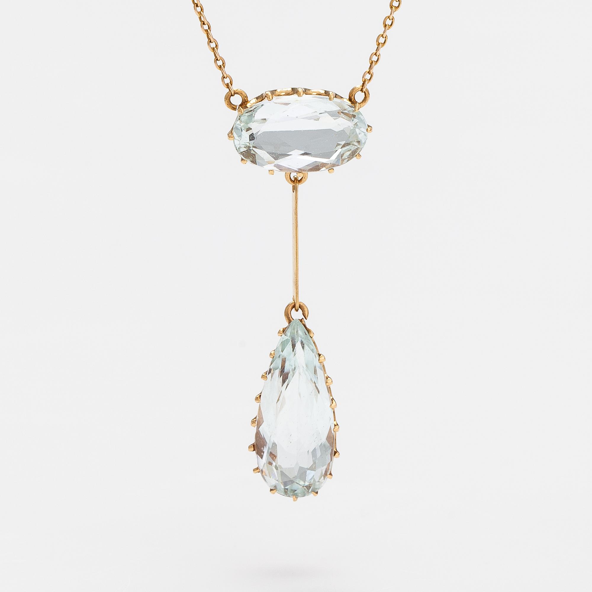 An 18K gold necklace with aquamarines.