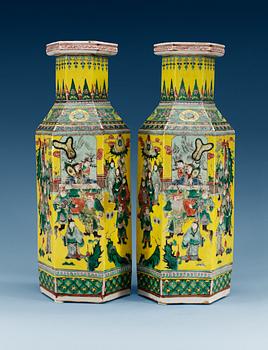 1663. A pair of yellow ground famille verte vases, Qing dynasty, 19th Century, with Qianlong´s four character mark.