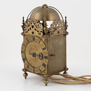 A Baroque brass lantern clock with bracket marked Andrew Prime Londini Fecit (active 1641- ca.1682).