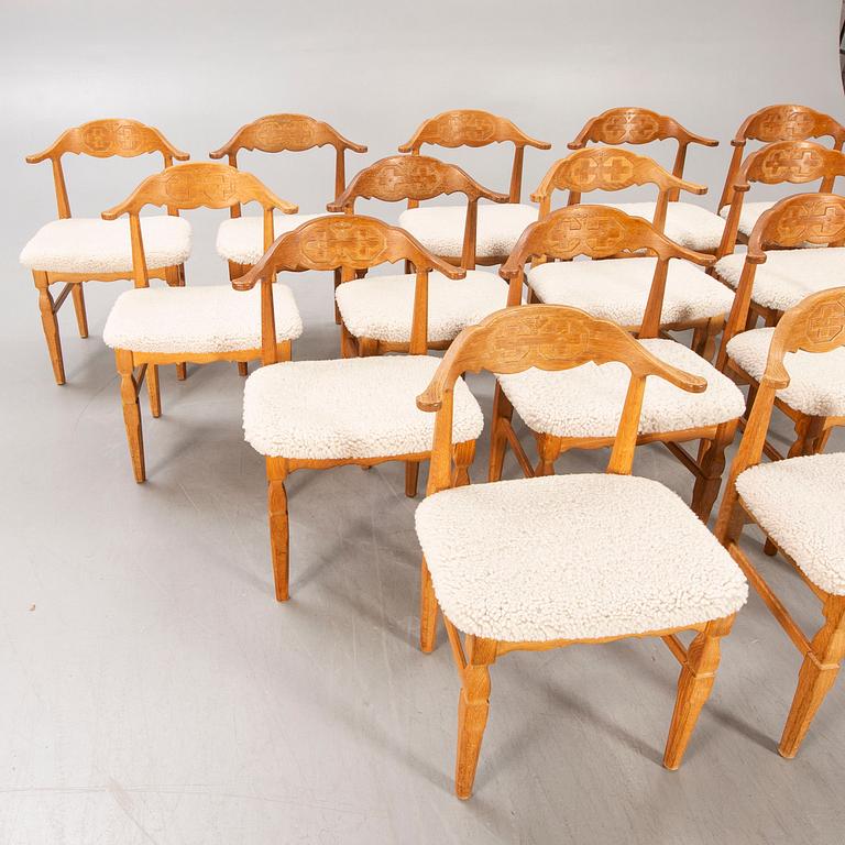 A set of 14 Henning Kjaerulf 1950s oak chairs.