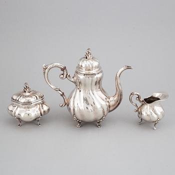 A silver coffee pot, creamer and sugar bowl. Swedish import marks.