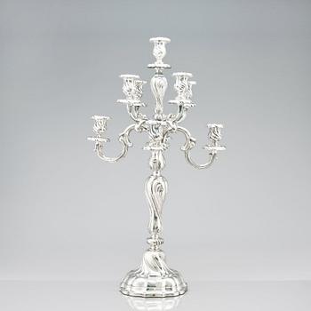 A pair of eight-light Louis XV-style silver candelabra, mark of Hermann Julius Wilm, Berlin, circa 1900.