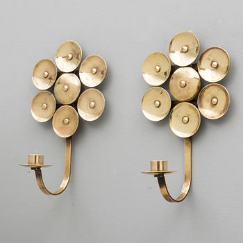 A Pair of Mid Century Swedish Brass Candle Holders by Mora KEE.