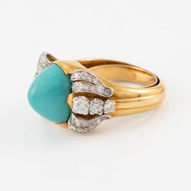 A W.A. Bolin ring in 18K gold with a turquoise and round brilliant- and eight-cut diamonds.