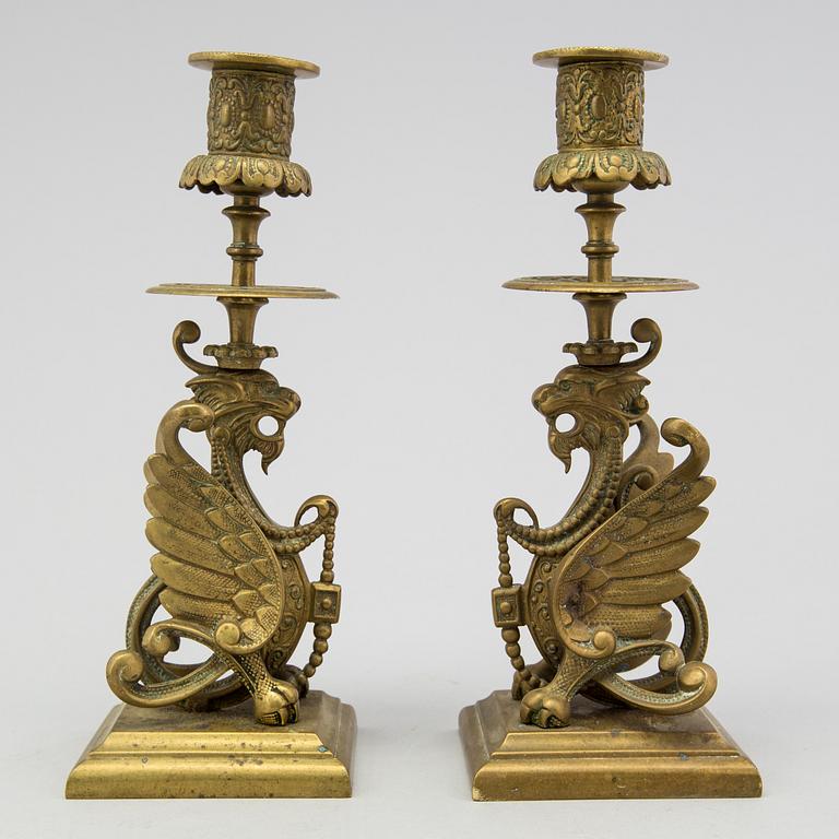 A pair of brass candle sticks late 19th century.