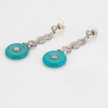 A pair of platinum earrings set with turquoises and old-cut diamonds  with a total weight of ca 1.30 cts.