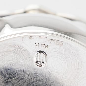 Two miniature beakers and a butter pan, Copenhagen, 1950s, and a silver-plated bottle coaster.