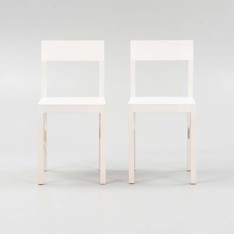 A pair of signed white stained pine chairs by Frederik Gustav for Frame, Copenhagen, 2023.