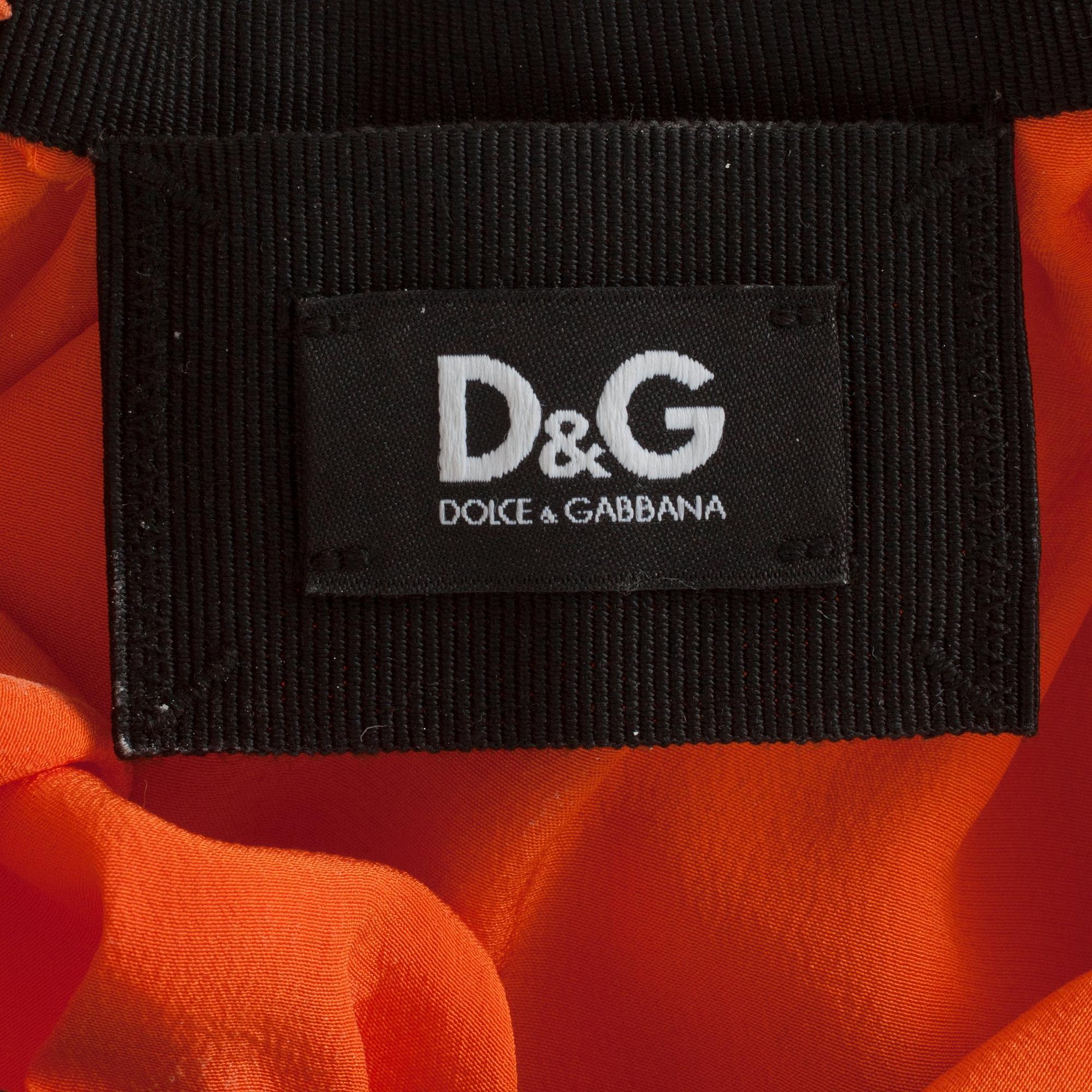 DOLCE & GABBANA, an orange silk cocktail dress.