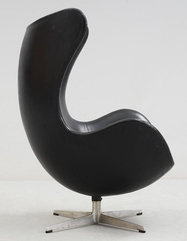 An Arne Jacobsen black leather 'Egg' chair, Fritz Hansen, Denmark 1966.