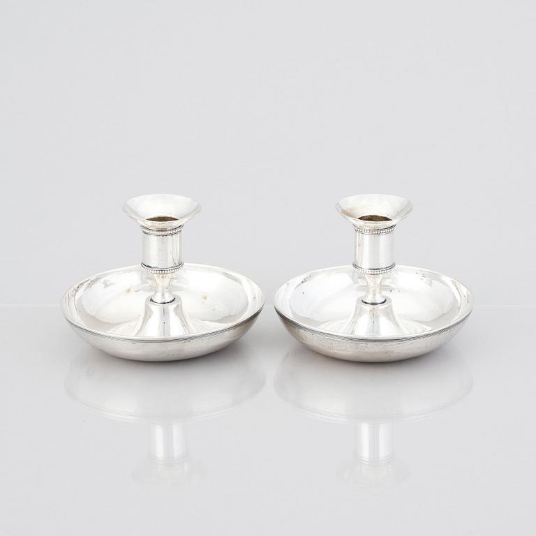 A pair of Swedish early 19th century silver chamber-candlesticks, mark of Adolf Zethelius, Stockholm 1816.