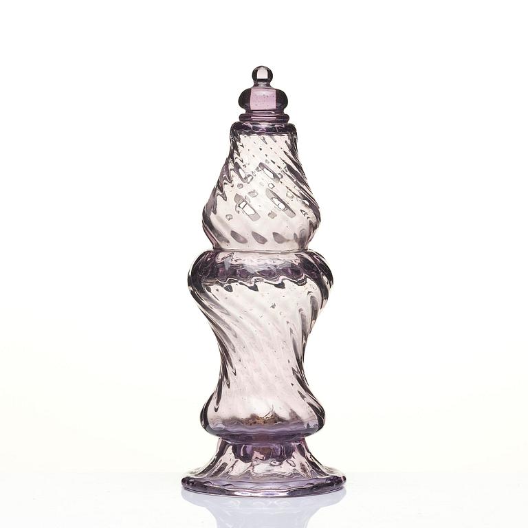 An amethyst coloured suger shaker and a cut glass goblet, 18th century.