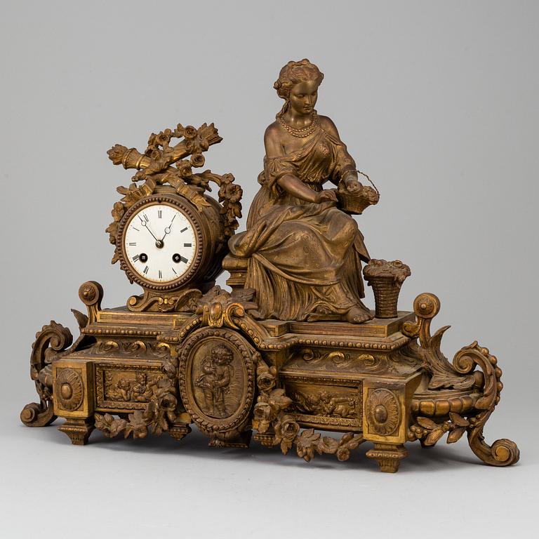 A  French 19th century mantle clock in Louis-XVI style.