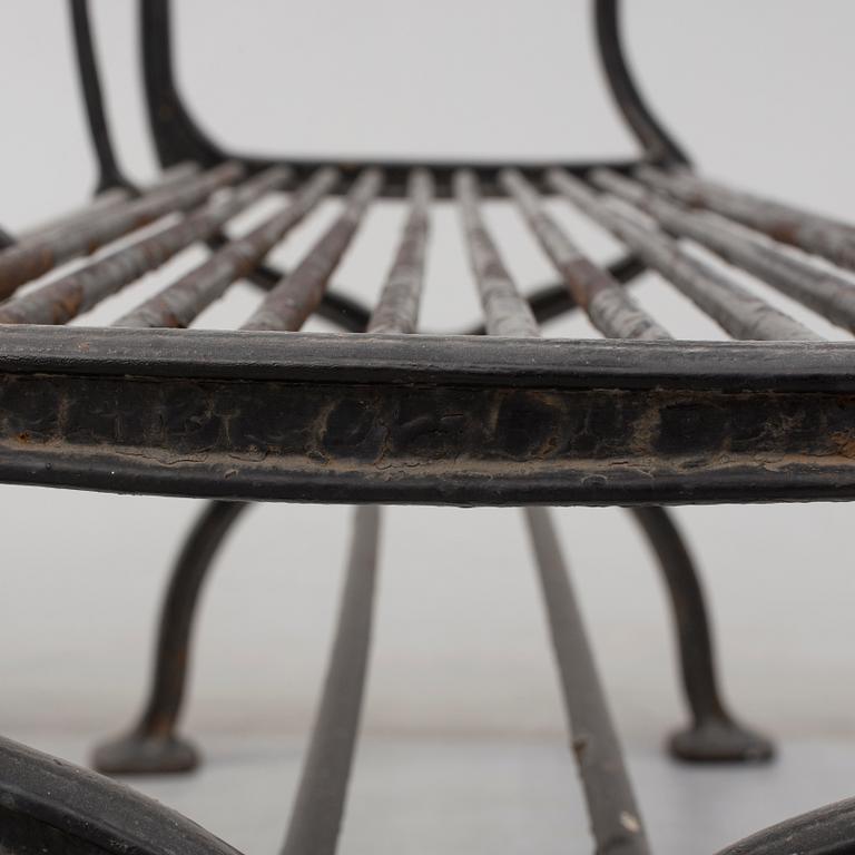 GARDEN SOFAS, a pair, cast iron, empire style, late 19th century.