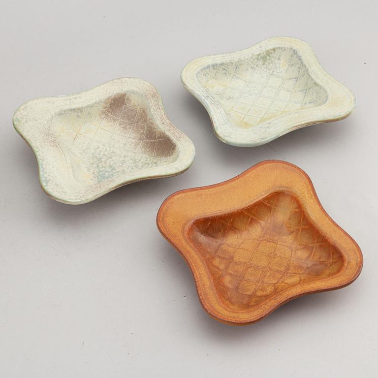 Gunnar Nylund, a stoneware dish and three bowls, Rörstrand, Sweden.