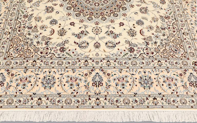 A Nain carpet, part silk, so called 6LAA, approximately 207 x 208 cm.