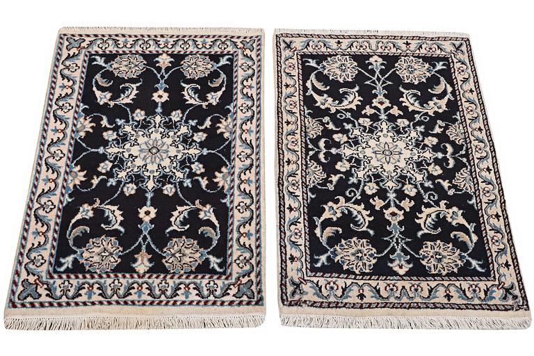 A pair of rugs, Nain, part silk, ca. 89 x 57 cm & ca. 90 x 60 cm.