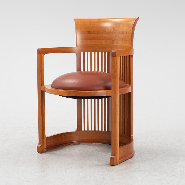 Frank Lloyd Wright, a model 606 'Barrel' chair from Cassina.