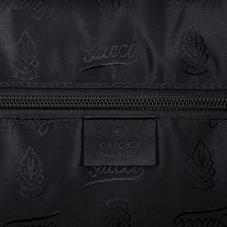 Gucci, a briefcase.