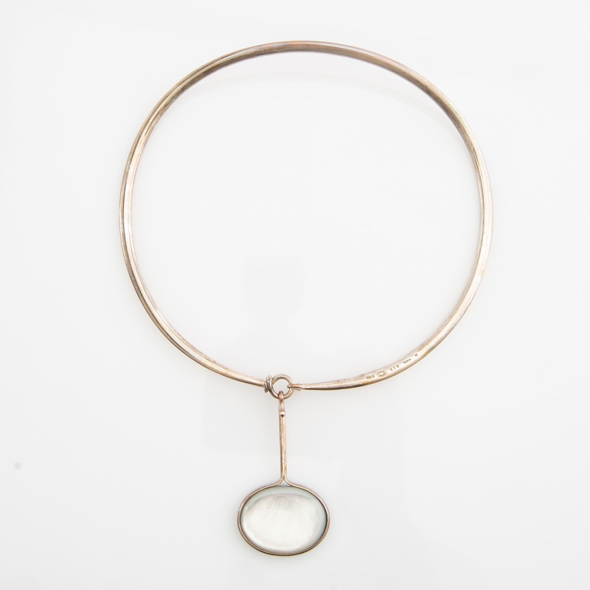 Vivianna Torun Bülow-Hübe, Necklace with pendant and a pair of earrings by Georg Jensen, Denmark, sterling silver and stone.
