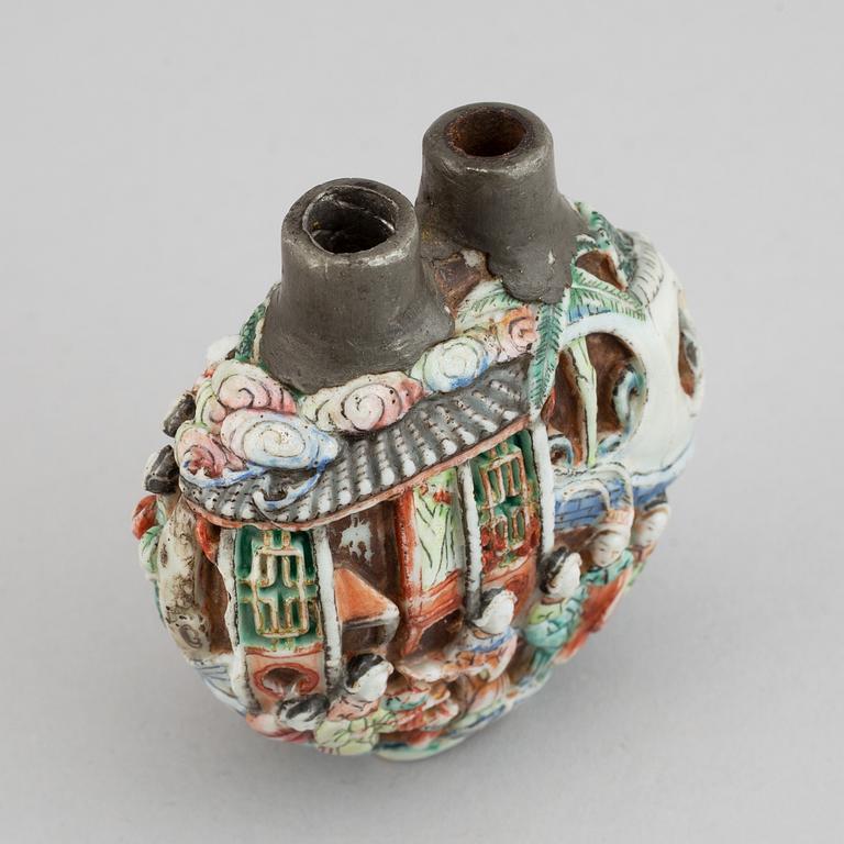 A famille rose moulded snuff bottle, Qing dynasty, 19th century.