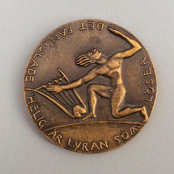 A bronze medal designed by Carl Milles for the opening of Stockholm Concert Hall 1926.