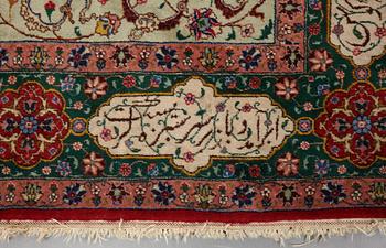 A carpet, semi-antique Tabriz, signed ca 335,5 x 256,5 - 261,5 cm.