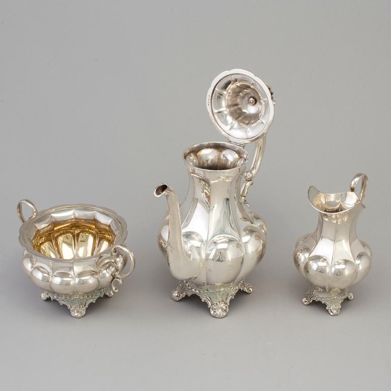 A three piece silver coffee set dated 1916-17.