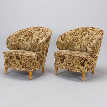 A pair of 1950s armchairs.