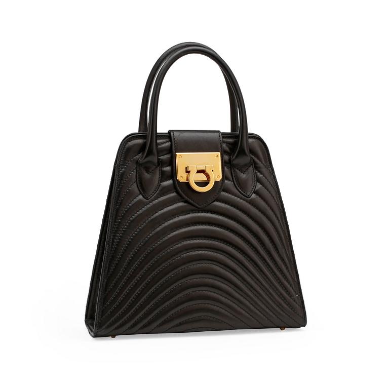 JEAN MICHEL NOUVEAU, a black leather top handle purse.