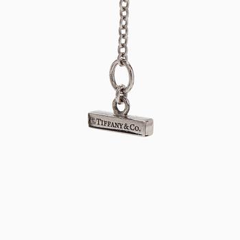 Tiffany & Co, kaulakoru, "T Two Circle", 18K valkokultaa ja turkoosi.