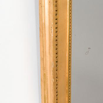 An Empire mirror, first half of the 19th century.