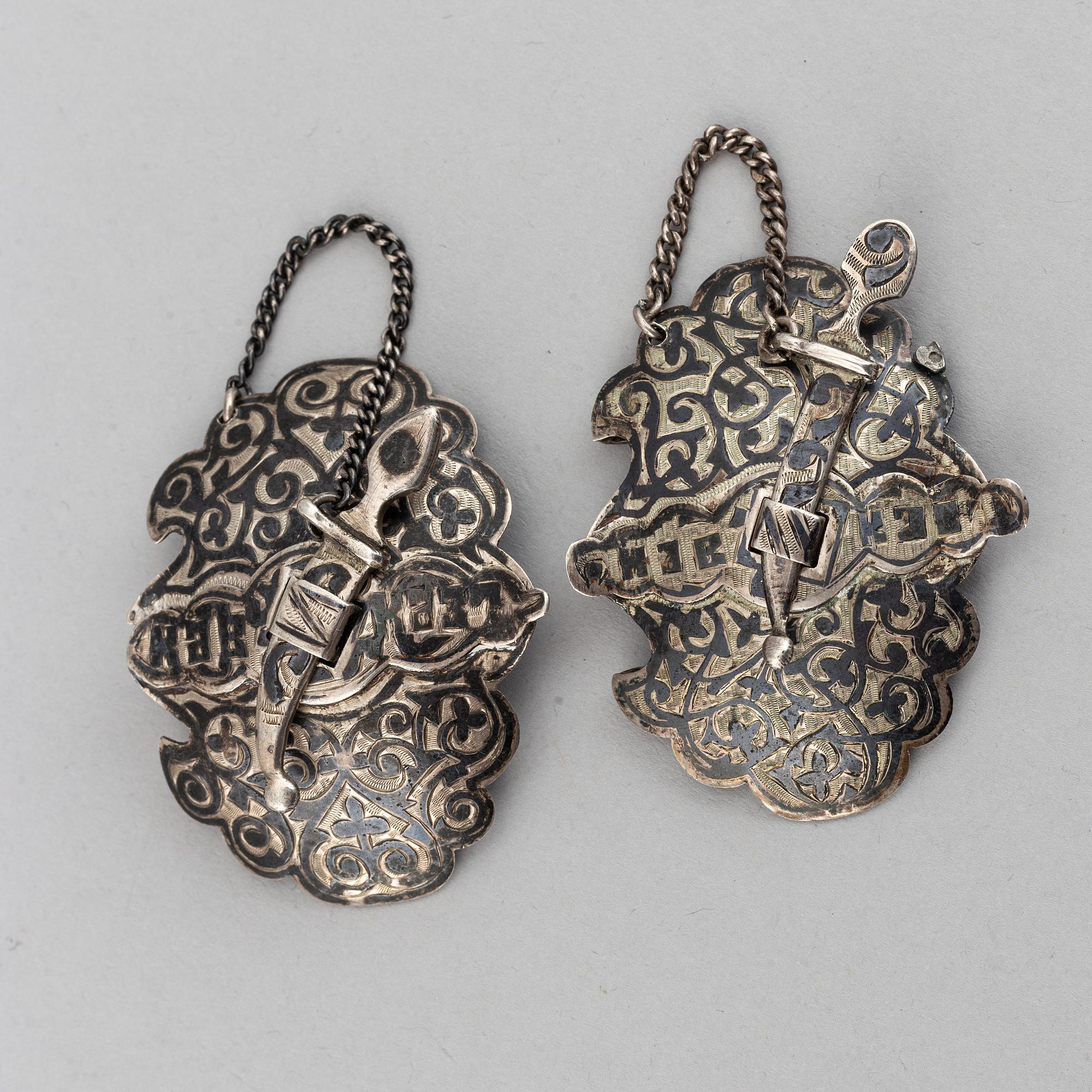 A Russian silver and niello bracelet and two belt buckles, unidentified makers mark, Kiev 1896-1908 and other.