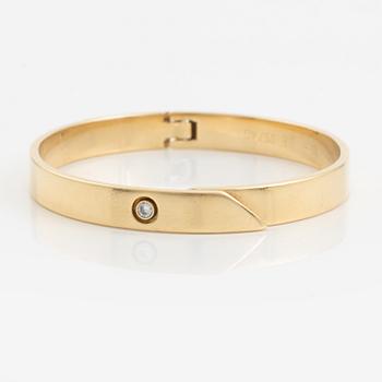 Cartier armband 18K guld med en rund briljantslipad  diamant "Anniversary Bracelet".