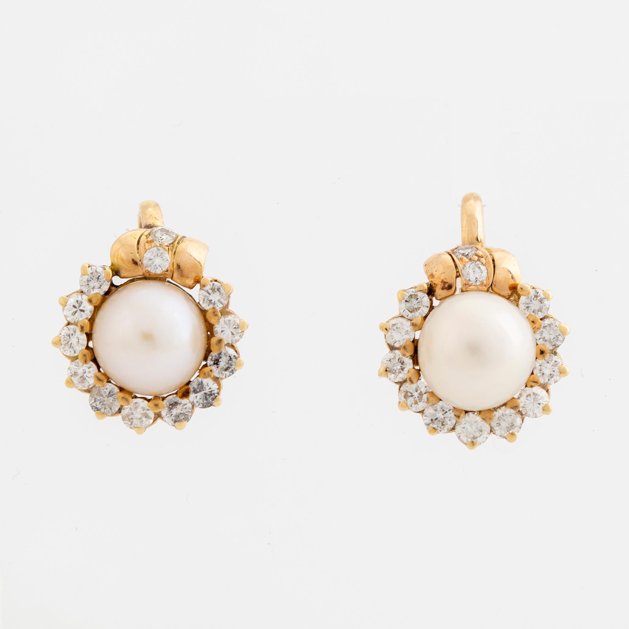 Cultured pearl and brilliant cut diamond earrings.