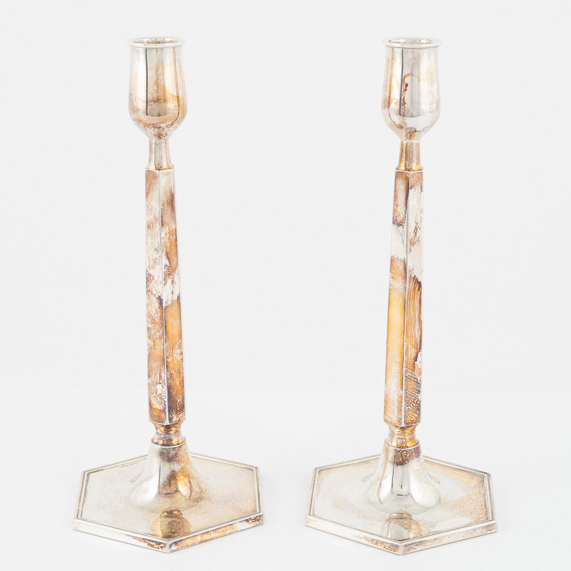 A pair of Swedish silver candlesticks, bearing the mark of K&EC, Gothenburg, 1965.