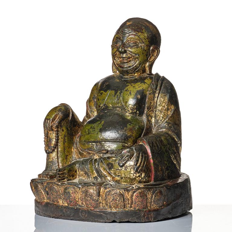 A large seated bronze figure of Budai, Ming Dynasty, dated to the fifth year of Jiajing (1526).