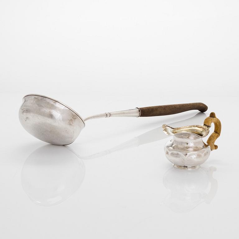 A silver ladle and cream jug,Johan Illberg, Viborg 1852, and unidentified master from Moscow, 1843.